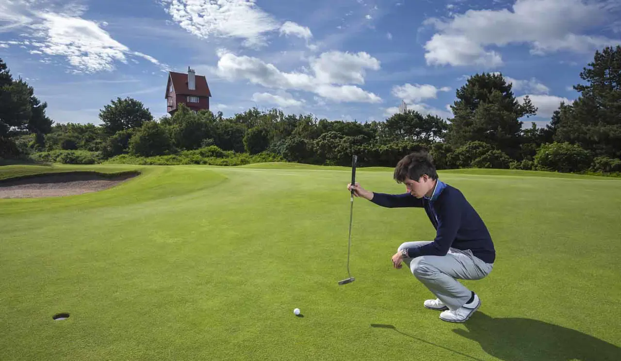 Final Putt On The 18Th With Golfer At Thorpeness Golf Course Suffolk
