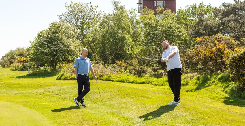 Golf Pro Dan Skriabin coaching a player