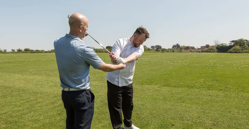 Golf Pro Dan Skriabin with a client